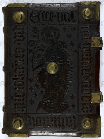 Front cover of "Historia Scholastica", by Petrus Comestor, c1451. Embossed leather cover, with brass studs and corner pieces. In the centre is the Virgin, crowned, with Christ in her arms. The Sun, Moon, and stars are represented in the backround. (Germany (Amerbach), circa 1451.