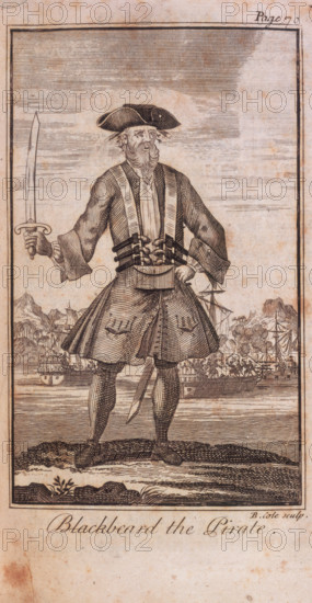 'Blackbeard the Pirate'. 1724. The engraving shows Blackbeard in costume, heavily armed and holding a sabre. In the background are ships at anchor. From "A General History of the Robberies and Murders of the most Notorious Pyrates, and also their policies, discipline and government, from their first rise and settlement in the island of Providence, in 1717, to the present year 1724. With the remarkable actions and adventures of the two female pyrates, Mary Read and Anne Bonny. To which is prefix'd an account of the famous Captain Avery ...To which is added, a short abstract of the statute and civil law, in relation to pyracy. By Captain Charles Johnson" by Charles Johnson (pseudonym of Daniel Defoe). (London, 1724).