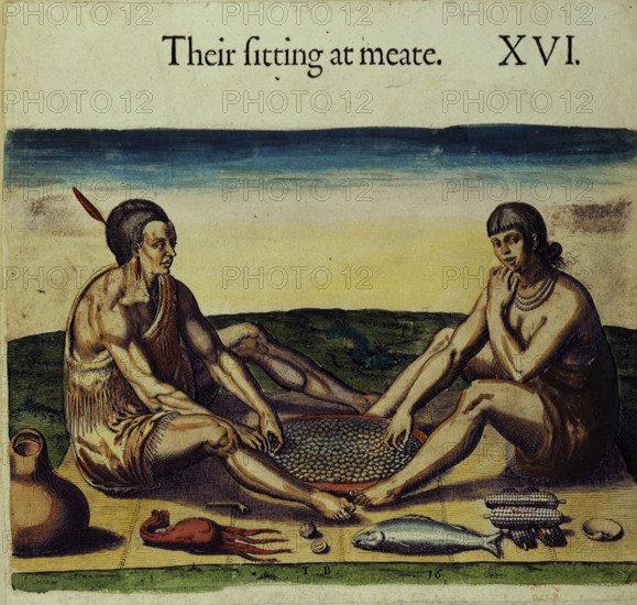Native Americans preparing food, 1618. Two Native Americans "sitting at meate", with food including fish, squid, nuts and corn. From "Travels through Virginia" by William Strachey. (England, 1618).