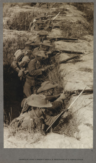 Gharwalis [sic] lining a reserve trench in expectation of a German attack, 1915 (1921). From India Office Official Record Of The Great War, 1921.