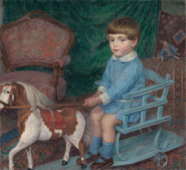 Boy with toy horse, c1925.