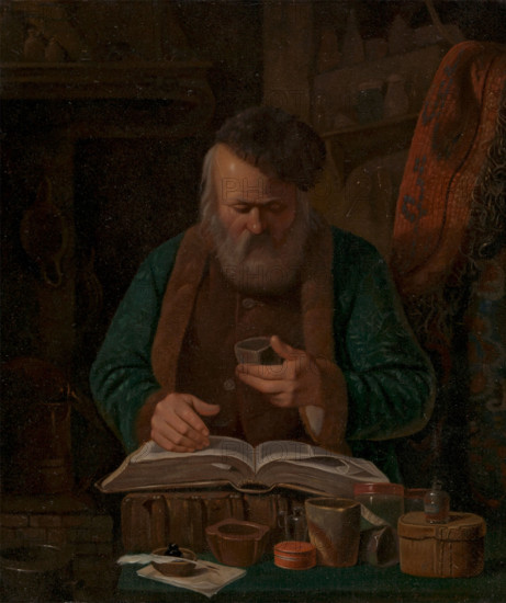 An alchemist or chemist examining a liquid, 1841. Creator: Charles-Emile Francois.