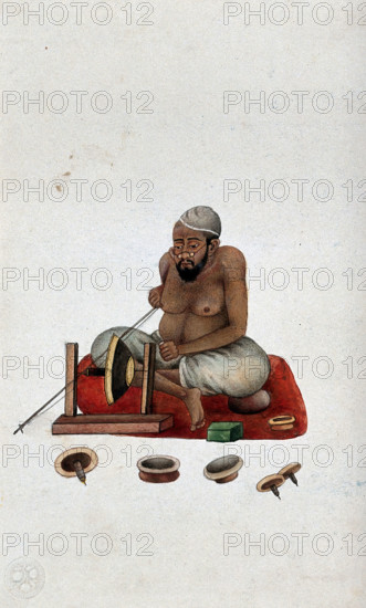 A lapidary at work cutting and polishing stones, (between 1800 and 1899?). Creator: Unknown.