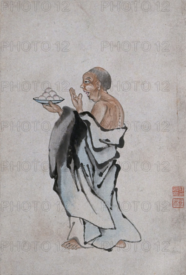 A Chinese man holding cakes on a tray, (between 1800 and 1899?). Creator: Unknown.