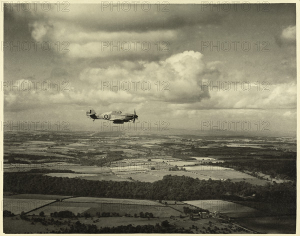 RAF Film Production Unit film still showing a 'hurribomber' in flight, 1942. Creator: Royal Air Force Fim Production Unit.