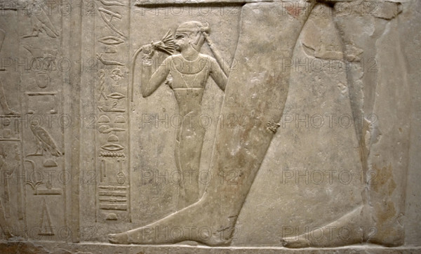 Relief of legs of Mereruka with his wife Watetkhethor..., Mastaba of Mereruka, Egypt, 2003. Creator: Unknown.