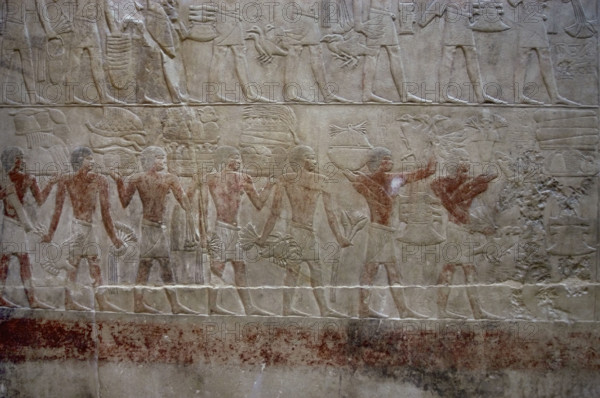Offering bearers, polychrome relief, Mastaba of Kagemni, Saqqara, Egypt, 2350 BC (2003). Creator: Unknown.