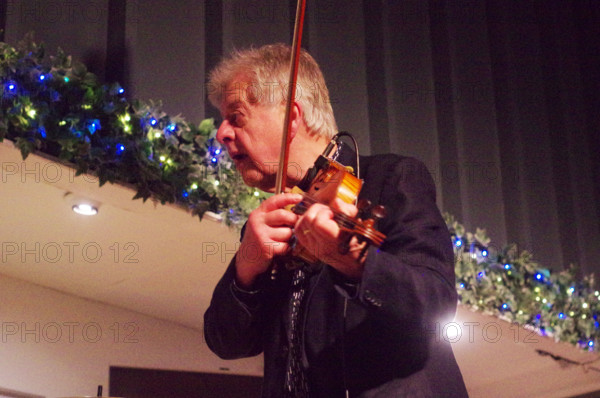 Mike Piggott, East Grinstead Jazz Club, Apron Café, Chequer Mead Theatre, West Sussex, April 2025. Creator: Brian O'Connor.