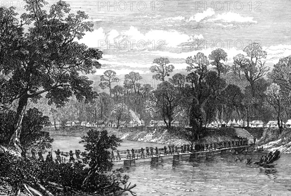The Ashantee War: the Camp at Prah-Su - native artillery crossing the river..., 1874. Creator: Unknown.