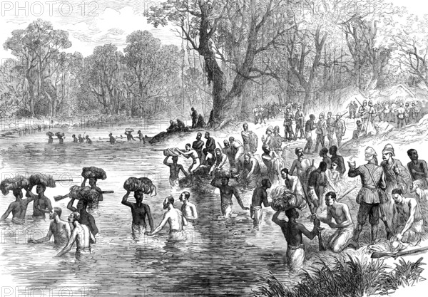 The Ashantee War - the return from Coomassie: crossing a river...sketch by our special artist, 1874. Creator: Unknown.