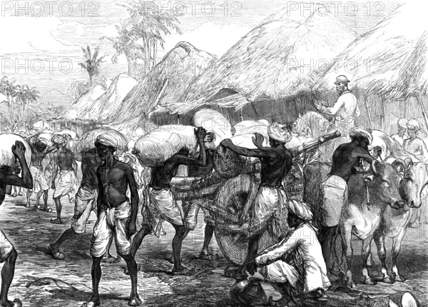 The Famine in Bengal: loading grain-carts near Calcutta, 1874. Creator: Unknown.