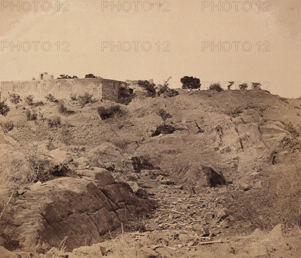 India: the ruins of Sammy House surrounded by scattered bones of sepoys killed in action, c1858. Creator: Felice Beato.