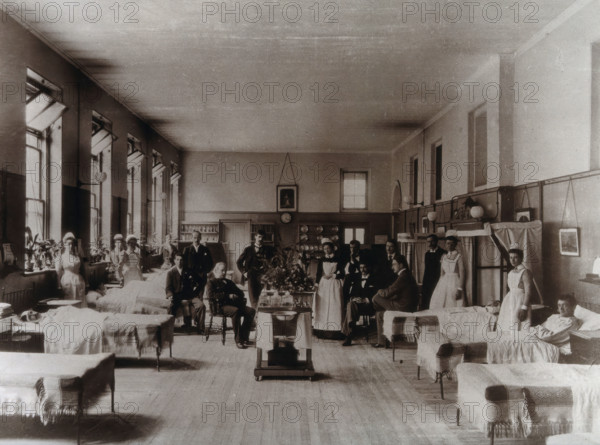 Baron Lister (seated) with his staff, Victoria ward, King's College Hospital, Lincoln's..., 1893. Creator: Unknown.