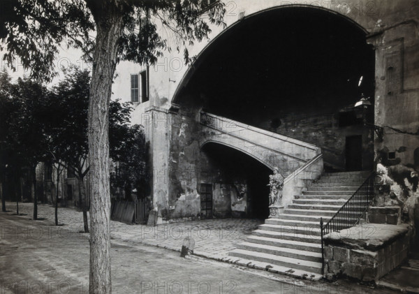 Hospital de la Santa Cruz, Barcelona: a staircase leading up to the men's department... Creator: Unknown.
