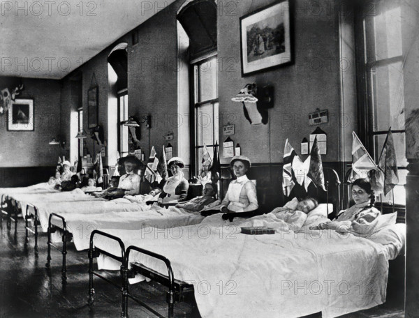 Hahnemann Hospital and Homeopathic Dispensaries, Liverpool: a women's ward, decorated..., [1910?]. Creator: Unknown.