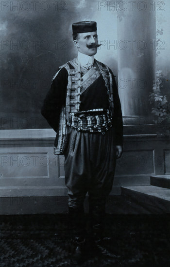 A Montenegrin man wearing national dress and a Montenegrin cap. Creator: Unknown.