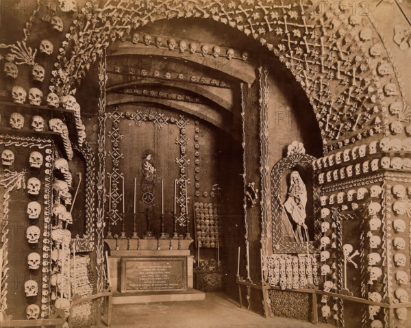An altar bearing a Latin inscription surrounded by an array of human skulls and bones and..., 1881. Creator: John Edmund Taylor.