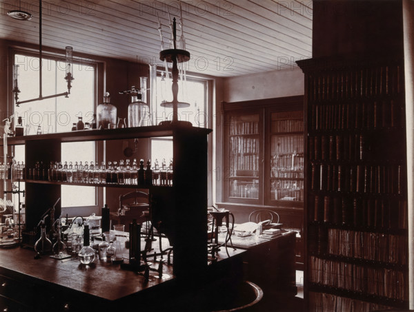 The interior of a pharmaceutical or chemical laboratory with a bench..., c1890s. Creator: Unknown.