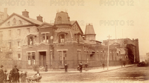 Bellevue Hospital, New York City: a street corner with hospital buildings and people, 1885-1898. Creator: Unknown.