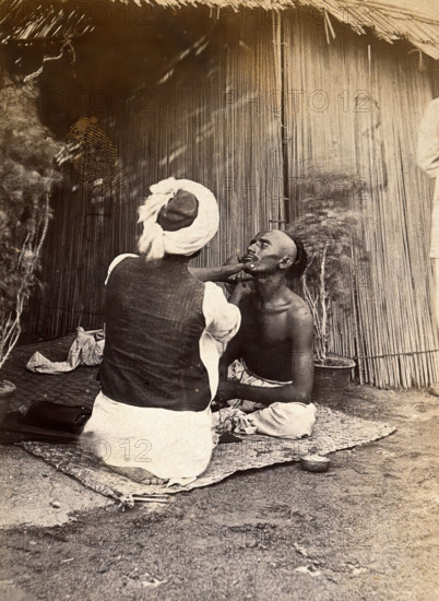 Man being shaved in one of the hospital camps, during the outbreak of bubonic plague..., 1897. Creator: Unknown.