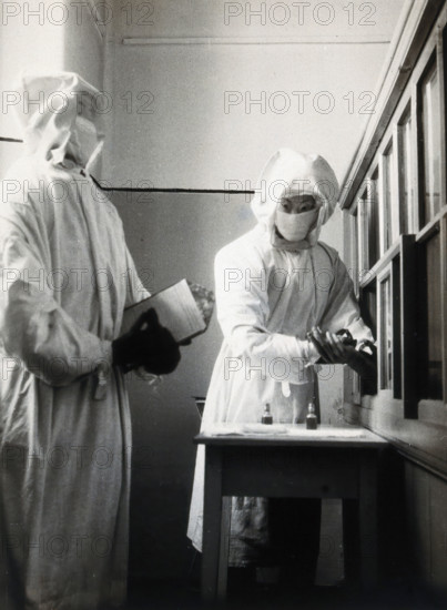 The inoculation of an isolated plague patient in China, c20th century. Creator: Unknown.