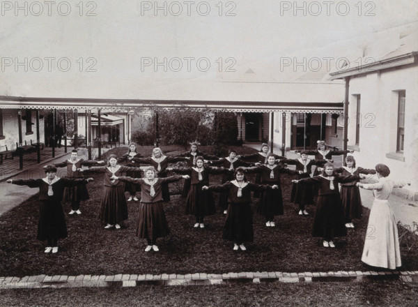 Metropolitan Lunatic Asylum, Kew, Victoria, Australia: female patients exercising, c1890s.. Creator: Unknown.