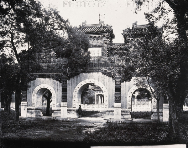 Hall of Classics (Guozijian), Peking: a triple archway of sculpted marble leading... 1871, (1981). Creator: Unknown.