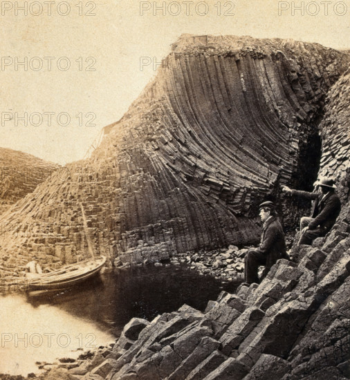 Staffa Island: two seated men admiring the basalt formations, c1880s. Creator: Unknown.