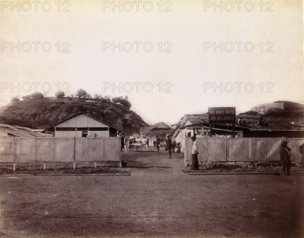 A plague patient being transported on a manually propelled ambulance carriage..., 1896/1897. Creator: Unknown.