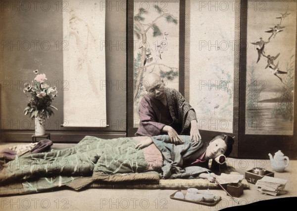 A Japanese woman being massaged by a blind Japanese masseur, c1890s. Creator: Unknown.