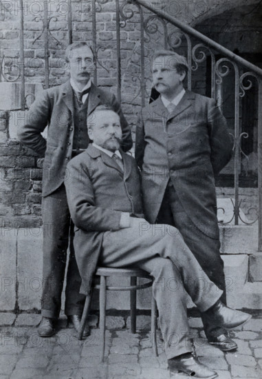 Charles Sherrington (left), Leon Fredericq (seated) and Paul Grützner (right) outside the...(1940?). Creator: Unknown.