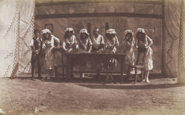 British servicemen in drag acting out a cooking class, 1918. Creator: Unknown.