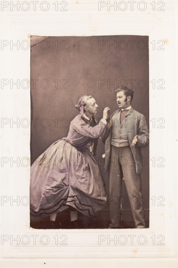 Two men, one in drag, posing in disagreement, [between 1890 and 1899?]. Creator: Unknown.