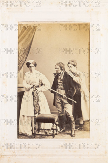 Three men, one in drag, acting out a scene, [between 1890 and 1899?]. Creator: Unknown.