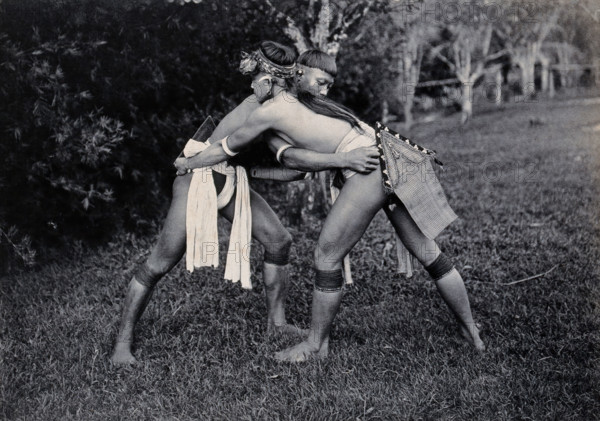 Sarawak: two Kayans wrestling, c1900. Creator: Unknown.