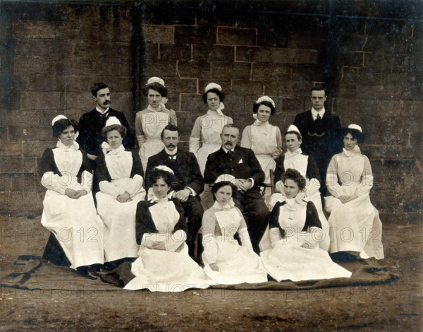 James Rutherford Morison with his staff: three men and ten women, c1900. Creator: Unknown.