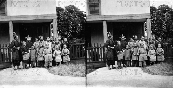 Fukien province, China: women and children outside a school (?), 1871. Creator: John Thomson.