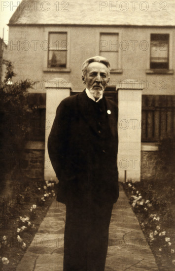 An unidentified man, standing in a garden, c1900. Creator: Unknown.