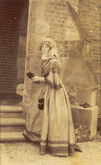 A man in drag posing in historical costume, (between 1890 and 1899?). Creator: Unknown.