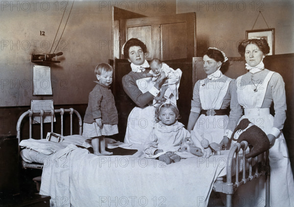 St Bartholomew's Hospital, London: nurses and children in casualty, c1890. Creator: Unknown.