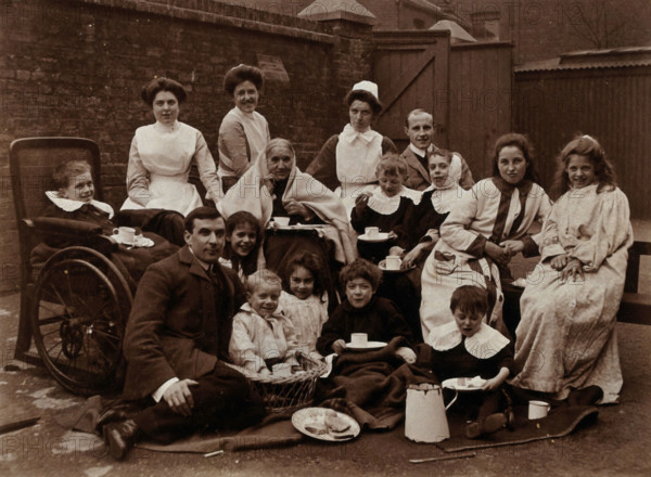 St Mary's Hospital, Plaistow: Basil Hood and Robert Archibald with patients and nurses..., 1904. Creator: Unknown.