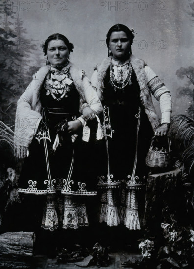 Two Bulgarian women arm-in-arm wearing national dress, c1900. Creator: Unknown.