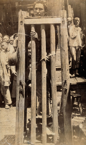 China: a man standing in a locked cage as a method of slow torture or execution, 19th century. Creator: Unknown.