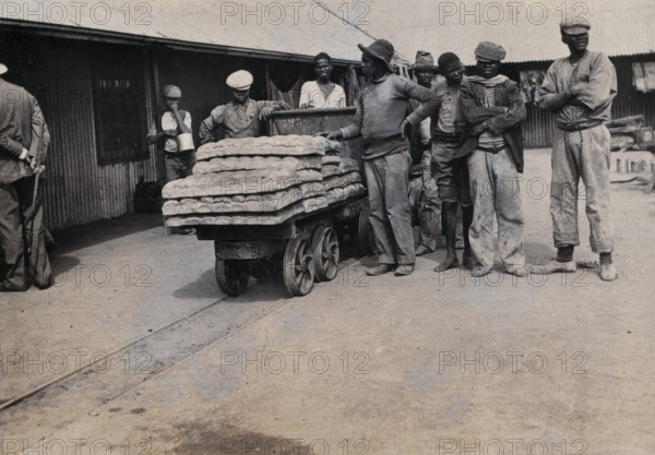 South Africa: bread carried on trolleys for the African workers at De Beers Mine, 1905. Creator: Hugh Marshall.