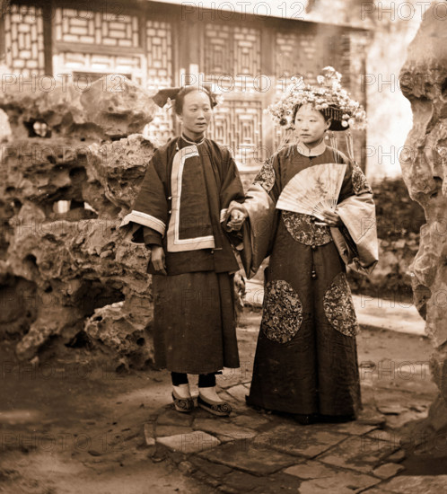 China: a Manchu bride in her wedding clothes with her maid, Beijing, 1869. Creator: John Thomson.