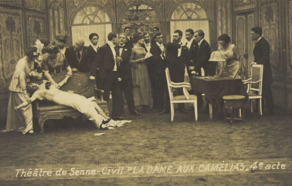 French or Belgian prisoners of war, some in drag, posing on stage during a crowded scene..., [1918?] Creator: Unknown.