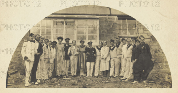 Sailors with men in drag outside a building, [between 1910 and 1919?]. Creator: Unknown.
