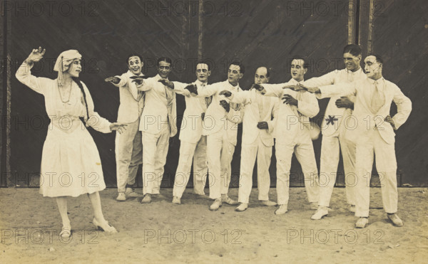 Actors, one in drag, performing on stage as "The Curios", c1918-1920. Creator: Unknown.
