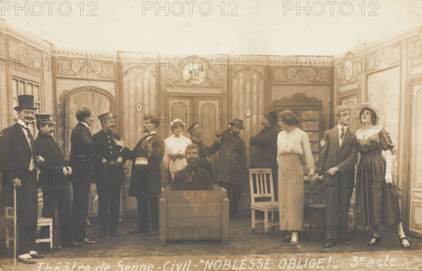 Prisoners of war, some in drag, posing on stage during a crowded scene of "Noblesse...(1910-1919?). Creator: Unknown.