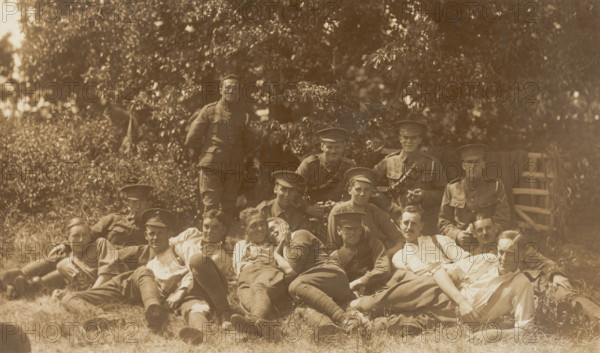 Soldiers relaxing in a field, (between 1910 and 1919?). Creator: Unknown.